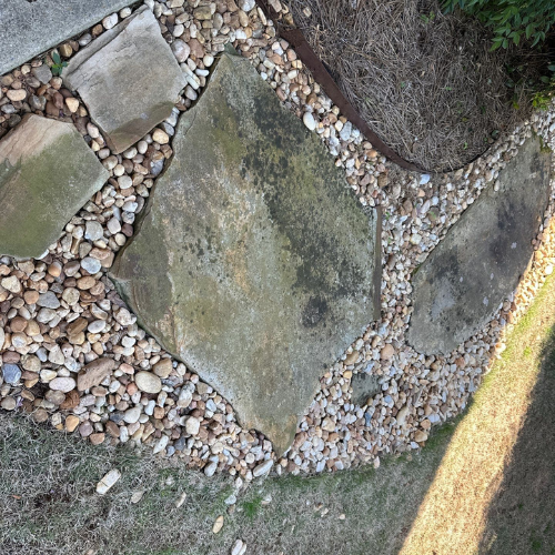 Stone paver patio before pressure washing - moss and grime buildup Atlanta GA